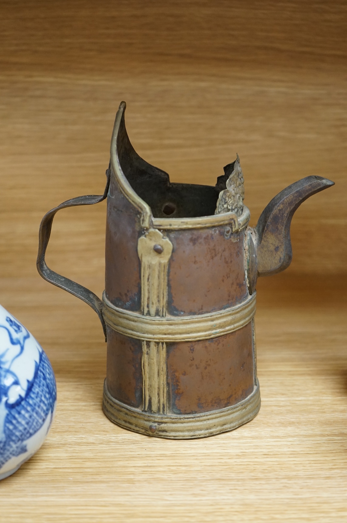 A Chinese blue and white bottle vase, a crackle glaze vase and a Tibetan copper and brass ‘monk’ cap’ ewer (3), tallest 21cm